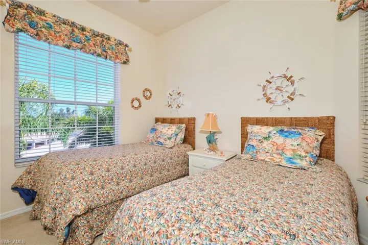 Bedroom with baseboards and carpet floors