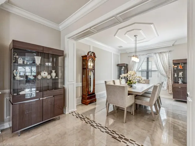 Formal dining room between kitchen and living room