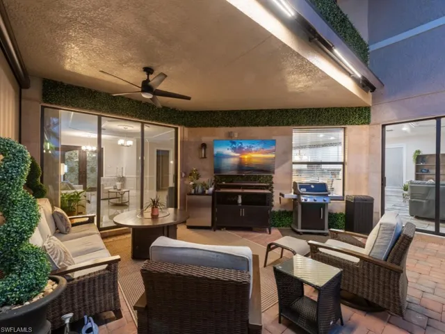Covered lanai with an additional retractable sun shade above