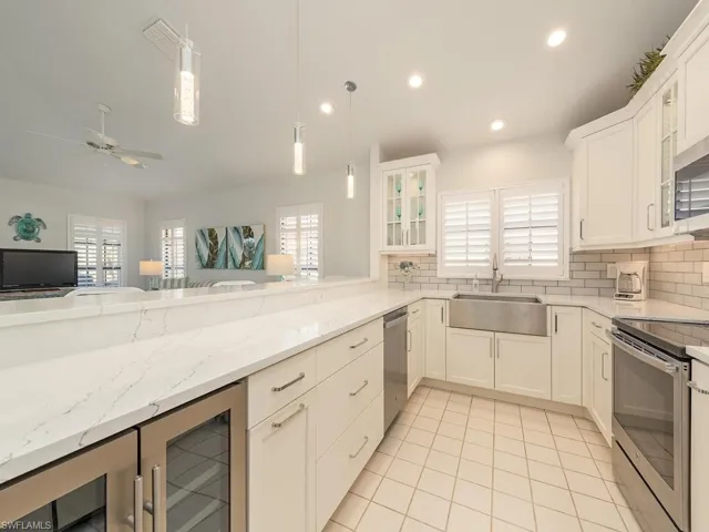 Beautifully renovated kitchen, stainless appliances, quartz counters