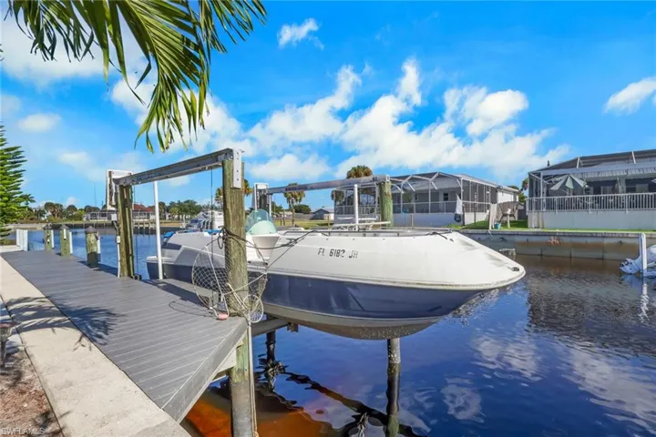Dock with a water view and boat lift