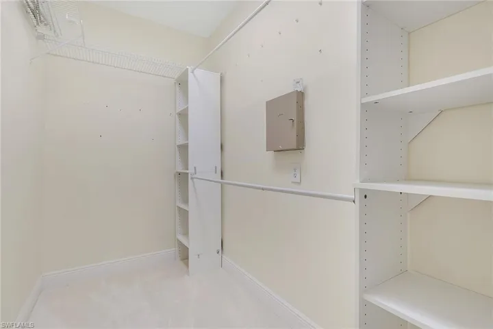 Walk in closet featuring carpet