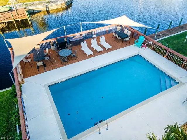 View of swimming pool featuring a water view