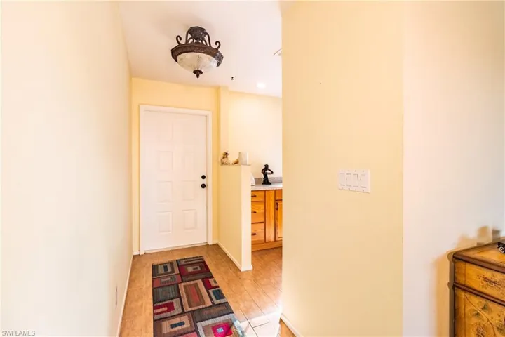 Hallway with light wood-type flooring