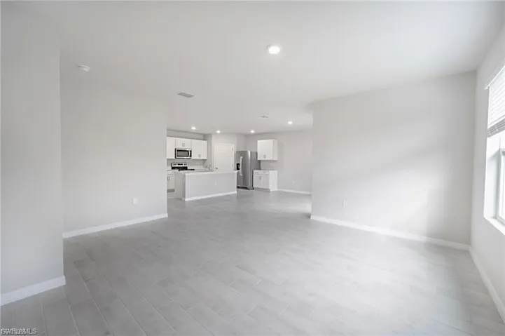 Unfurnished living room featuring recessed lighting and light wood-style floors