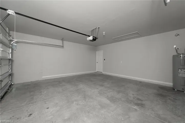 Garage featuring water heater
