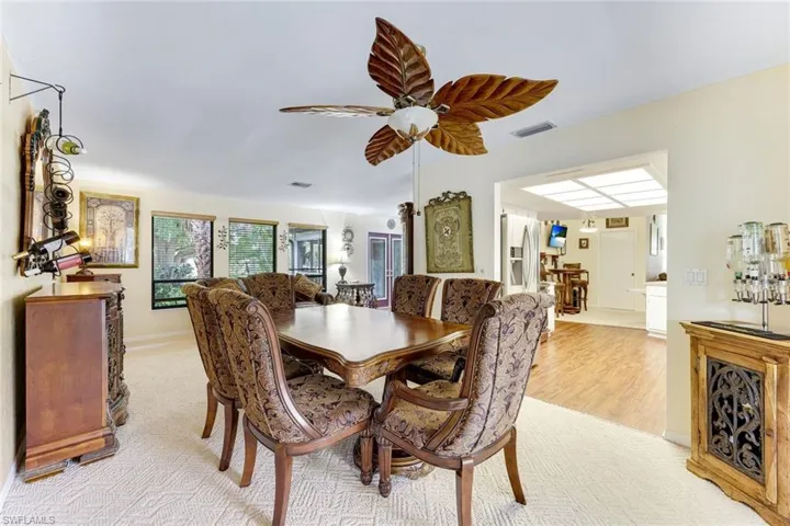 Dining space featuring ceiling fan and light wood-type flooring
