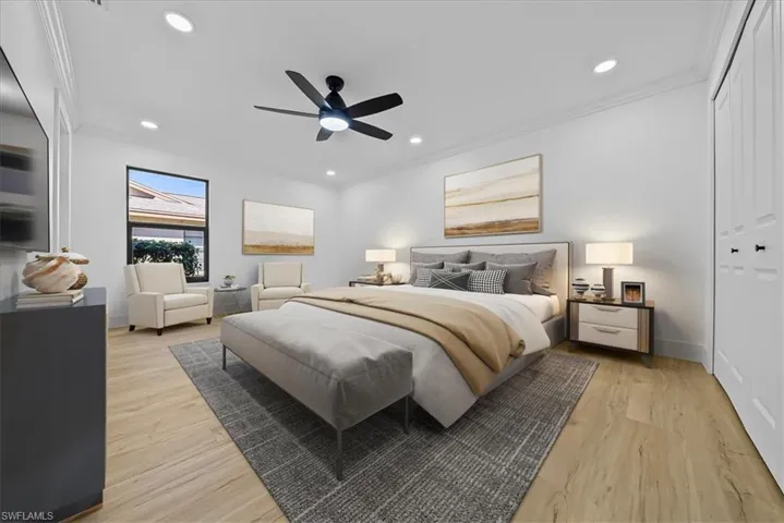 Bedroom with light wood-style floors, recessed lighting, crown molding, ceiling fan, and a closet