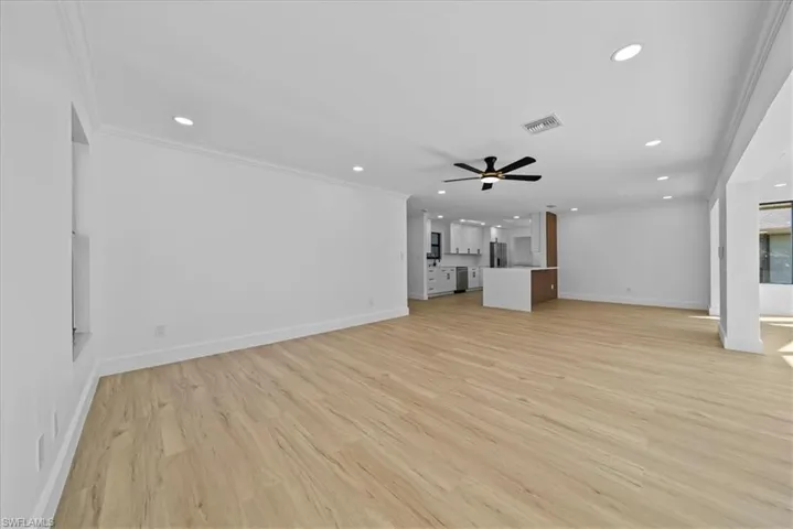 Unfurnished living room with light wood-style flooring, recessed lighting, and a ceiling fan