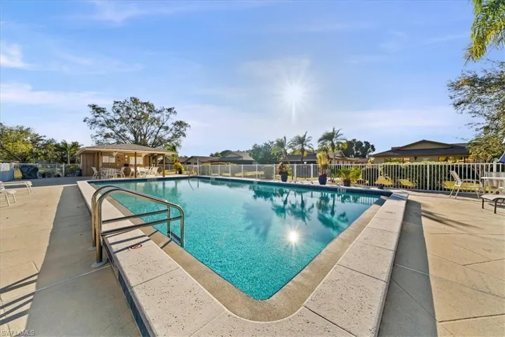 Community pool featuring a patio