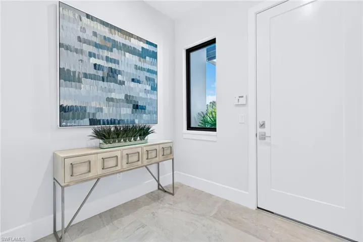 Elegant modern entryway from garage space
