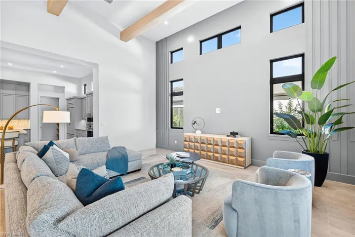 Airy, modern great room,the transom and vertical windows bring in abundant natural light