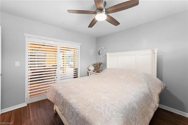 Bedroom with wood finished floors and ceiling fan