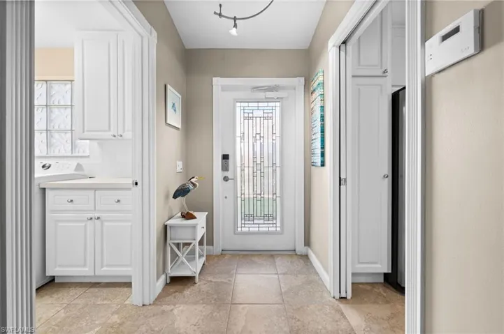 Step inside to an open, light-filled design with vaulted ceilings and a seamless flow throughout.