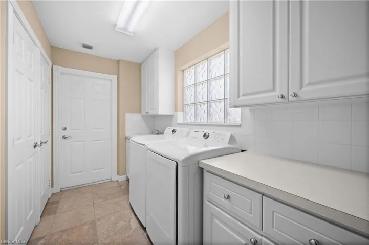 Spacious laundry room with additional storage
