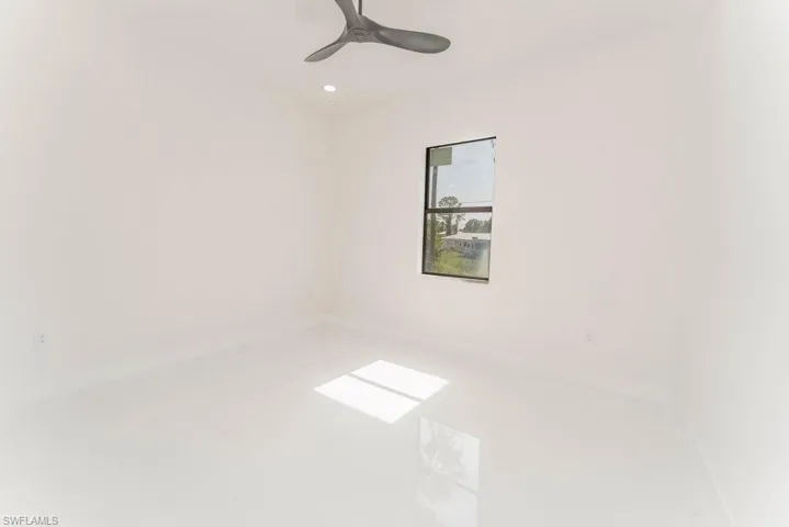 Spare room with recessed lighting and ceiling fan