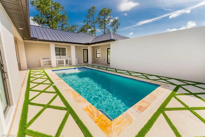 Outdoor pool with a patio area