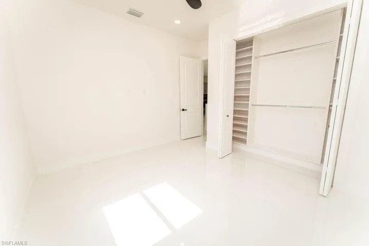 Unfurnished bedroom featuring a closet, recessed lighting, and ceiling fan
