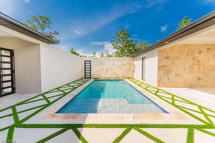 View of pool featuring a patio and a fenced backyard