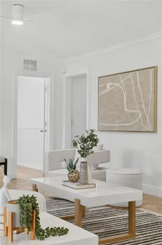 Large spacious living area with a bright and open concept floor plan, recess lighting throughout and new ceiling fans.