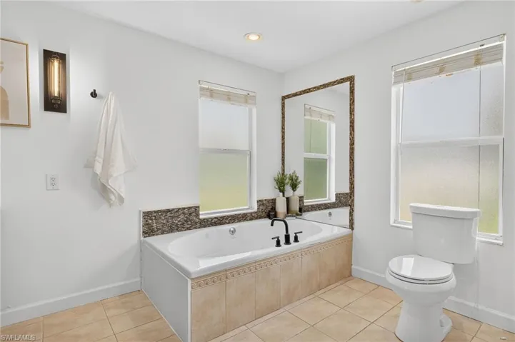 Master bathroom with dual sink, large jetted tub with a separate shower