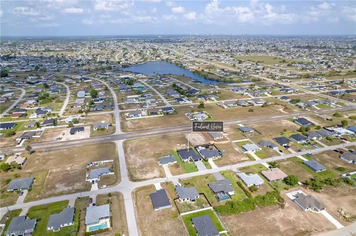 Aerial overview of property's location with nearby suburban area