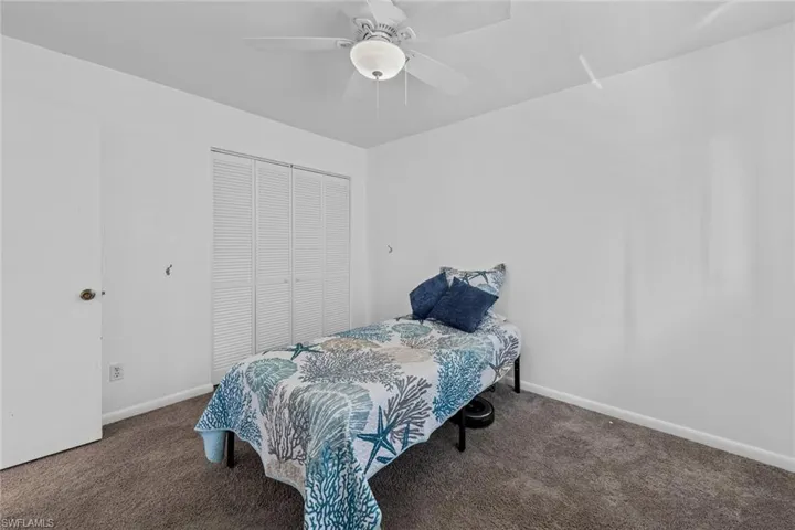 Bedroom #3 featuring  carpet, ceiling fan, and a closet
