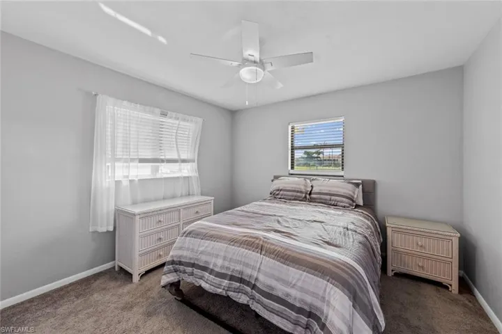 Bedroom #2 with carpet flooring and ceiling fan