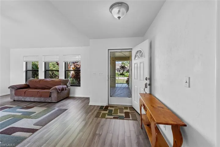 Foyer entrance with hardwood / wood-style flooring