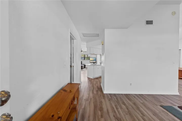 Foyer with light hardwood / wood-style floors
