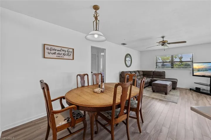 Dining area featuring hardwood / wood-style floors and ceiling fan