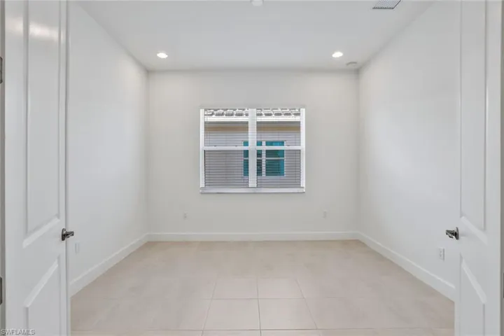 View of tiled spare room