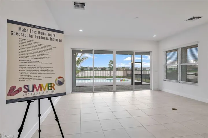 Unfurnished room featuring light tile floors