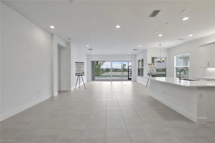 Unfurnished living room with light tile floors