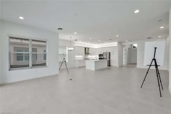 Unfurnished living room with light tile floors