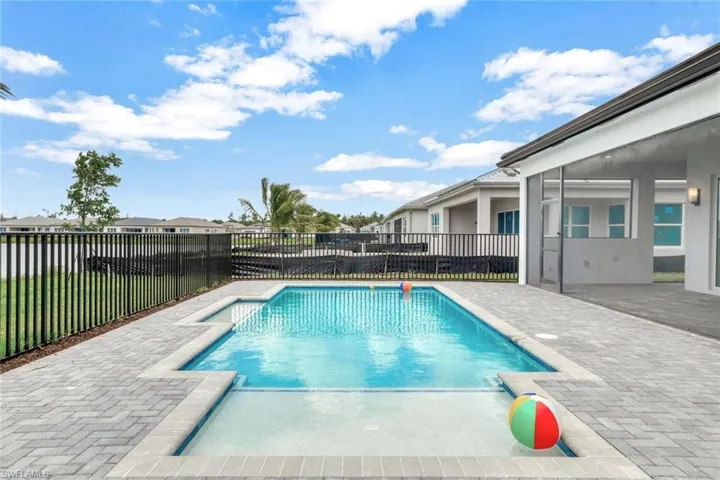 View of swimming pool with a patio area