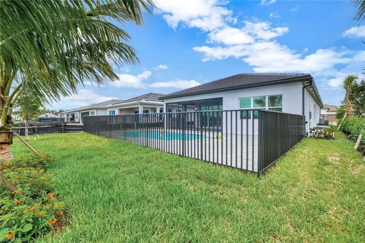 View of yard with a fenced in pool