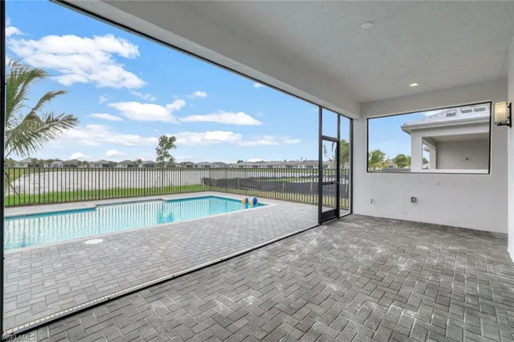 View of swimming pool with a patio area