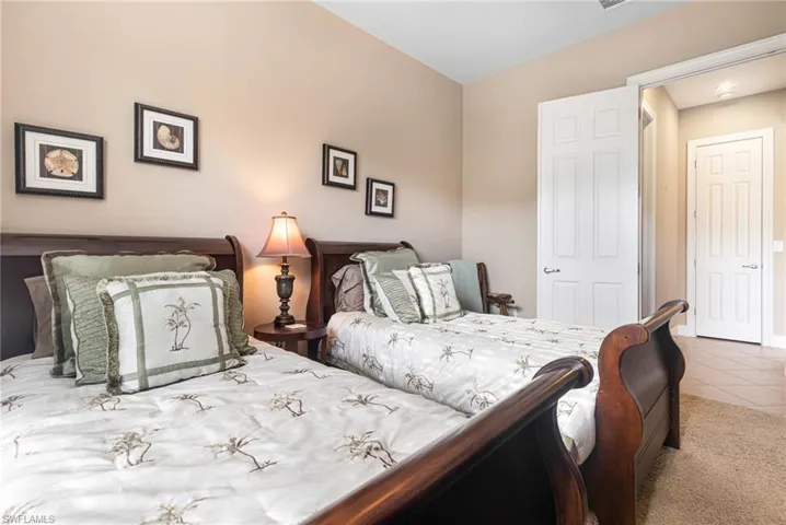 Bedroom with carpet flooring and tile patterned flooring