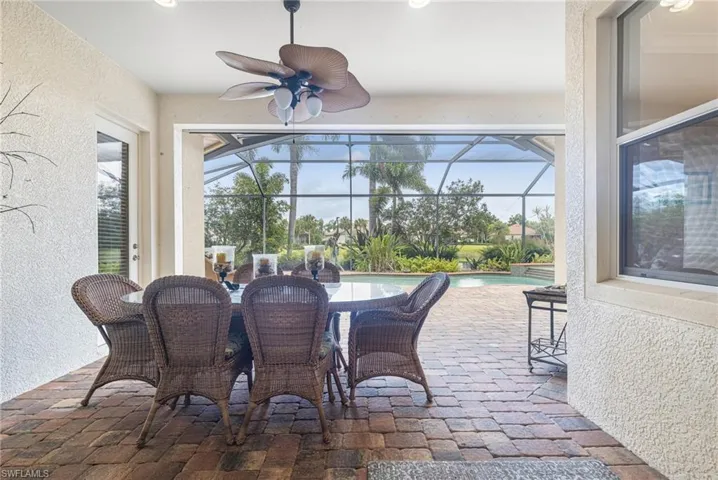 Sunroom / solarium featuring a ceiling fan