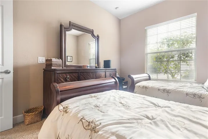 Bedroom with carpet flooring and baseboards