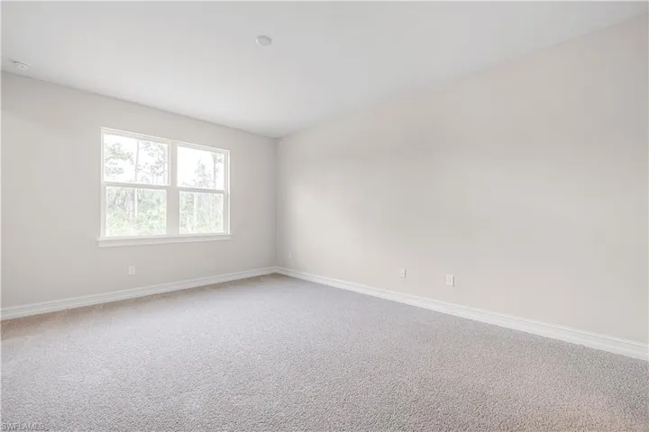 Spare room with carpet floors