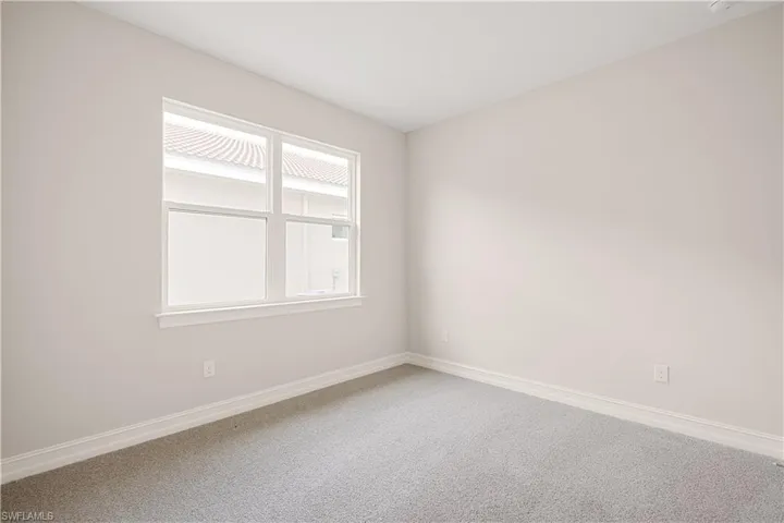 Unfurnished room featuring carpet