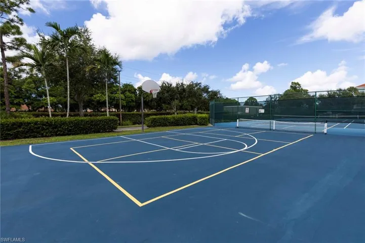 View of sport court featuring tennis court