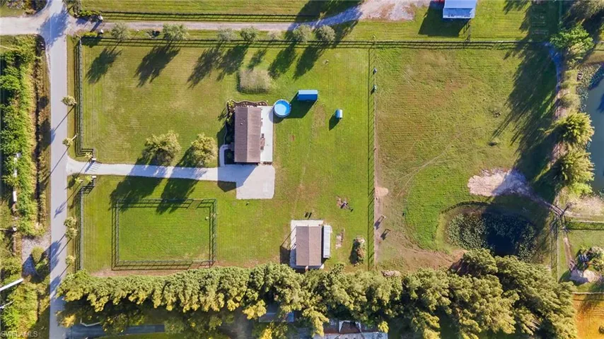 Birds eye view of property with a rural view