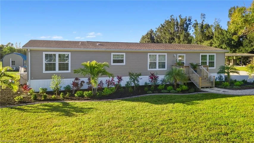 View of front of house featuring a front lawn
