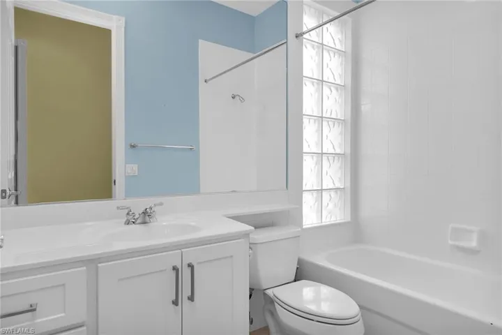 Full bath with vanity and shower / tub combination