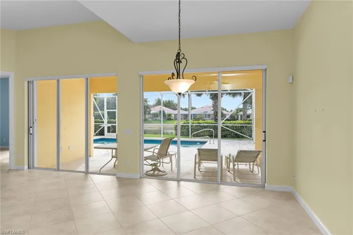 Entryway featuring a sunroom and tile patterned flooring