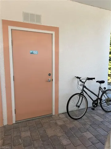 Property entrance with stucco siding