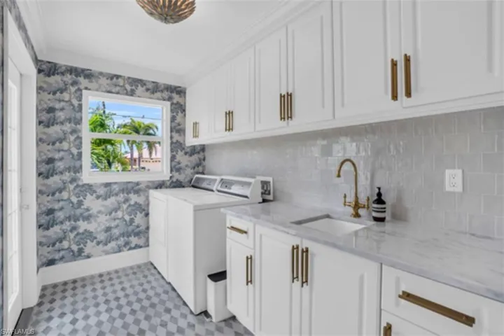 Remodeled laundry room with exterior entrance.